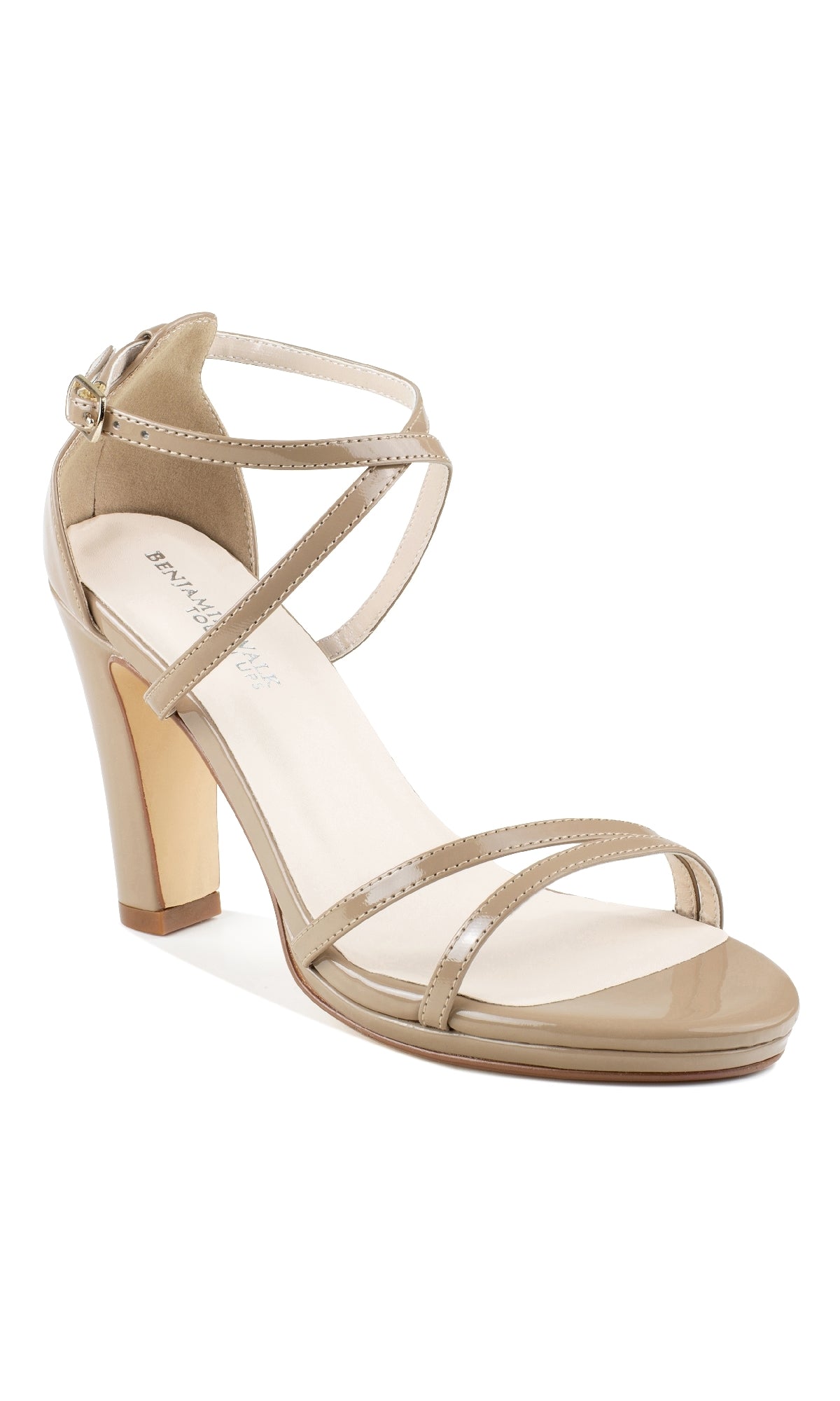 Step out in style with the Reign Dark Nude Prom Shoes: Touch Ups 4644—beige patent leather, open-toe high-heeled sandals featuring an ankle strap and buckle closure, perfect to complete your prom dress shoe collection.